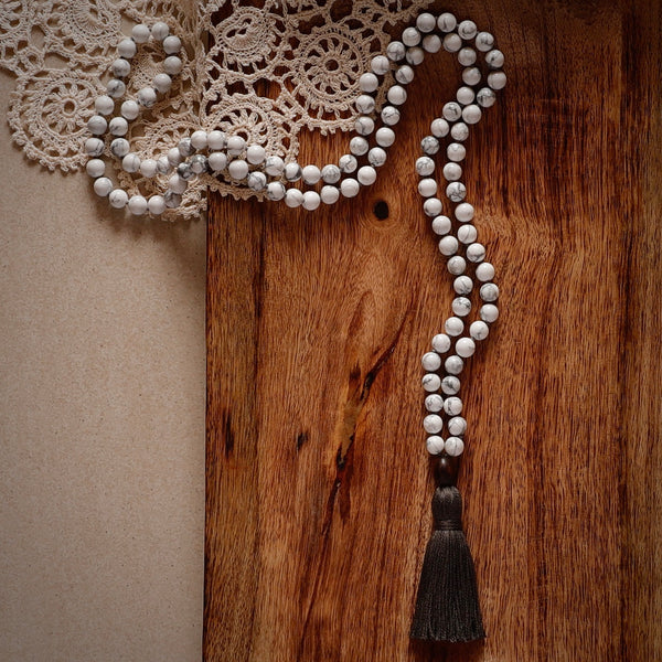 Calm Mala Beads. Hand-knotted with beautiful, untreated, high-grade Howlite beads, featuring a wooden guru bead and handmade cotton tassel.