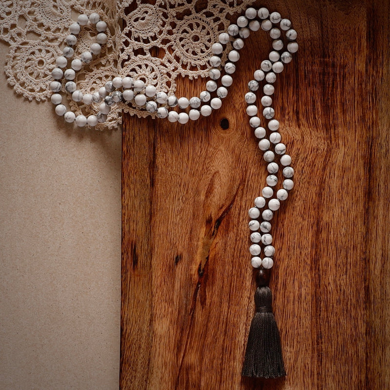 Calm Mala Beads. Hand-knotted with beautiful, untreated, high-grade Howlite beads, featuring a wooden guru bead and handmade cotton tassel.