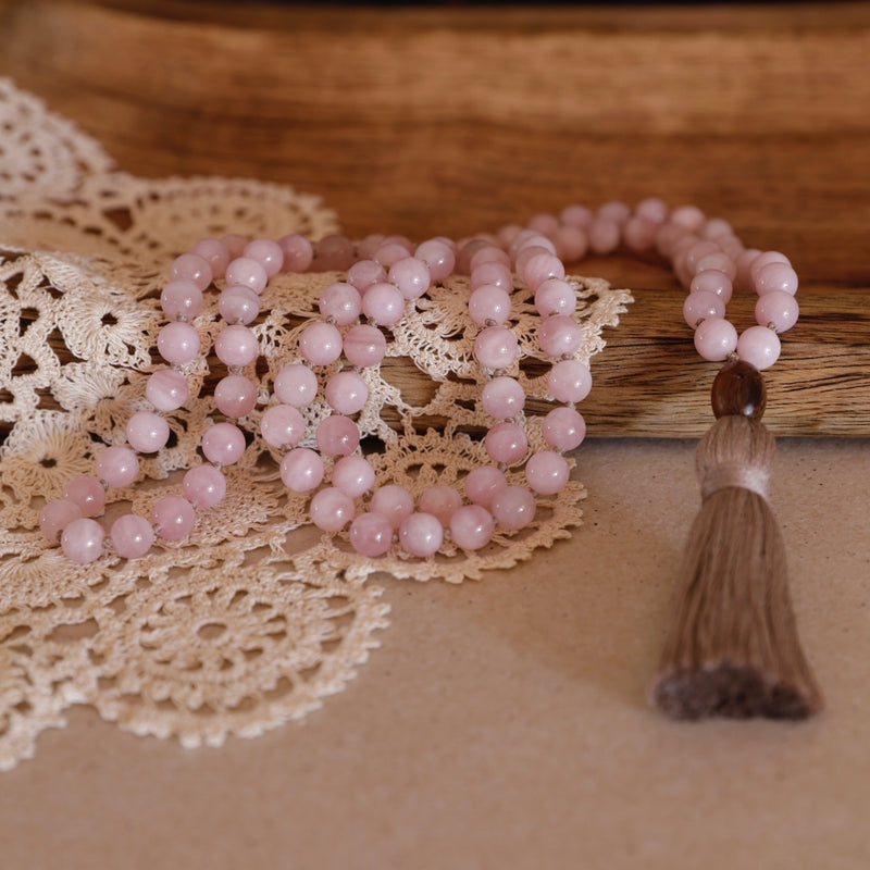 Love Mala Beads. Hand-knotted with beautiful, untreated, high-grade Rose Quartz beads, featuring a wooden guru bead and handmade cotton tassel.